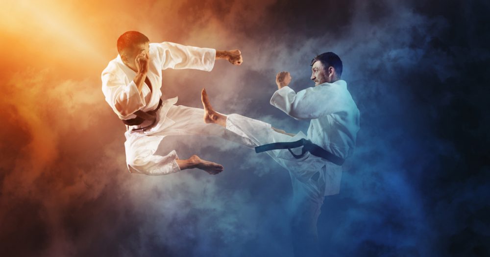 Martial arts masters, karate practice. Two male karate fighting